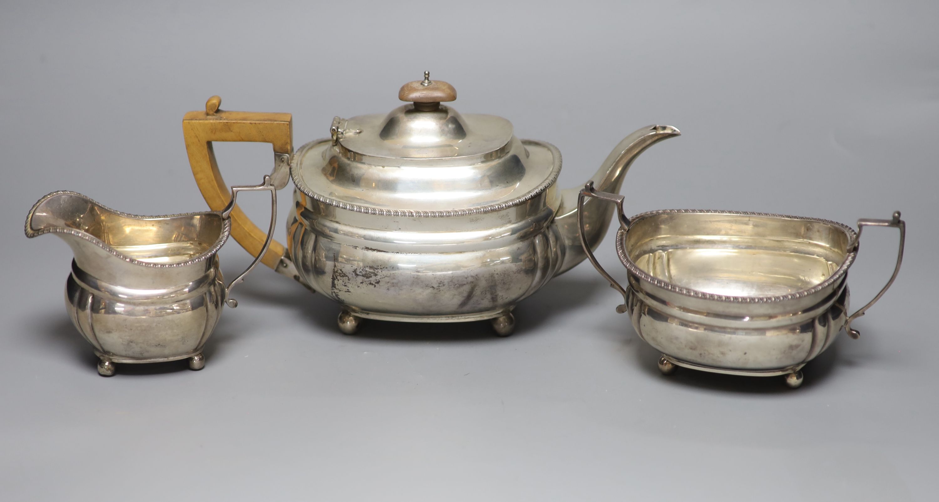A George V three piece silver tea set, Harrod's Ltd, London, 1920/1